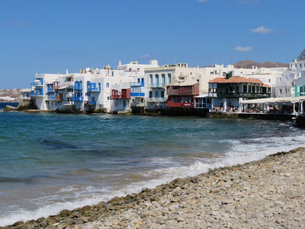 Mykonos in Greece.  View towards the bustling, tourist filled, seaside restaurants