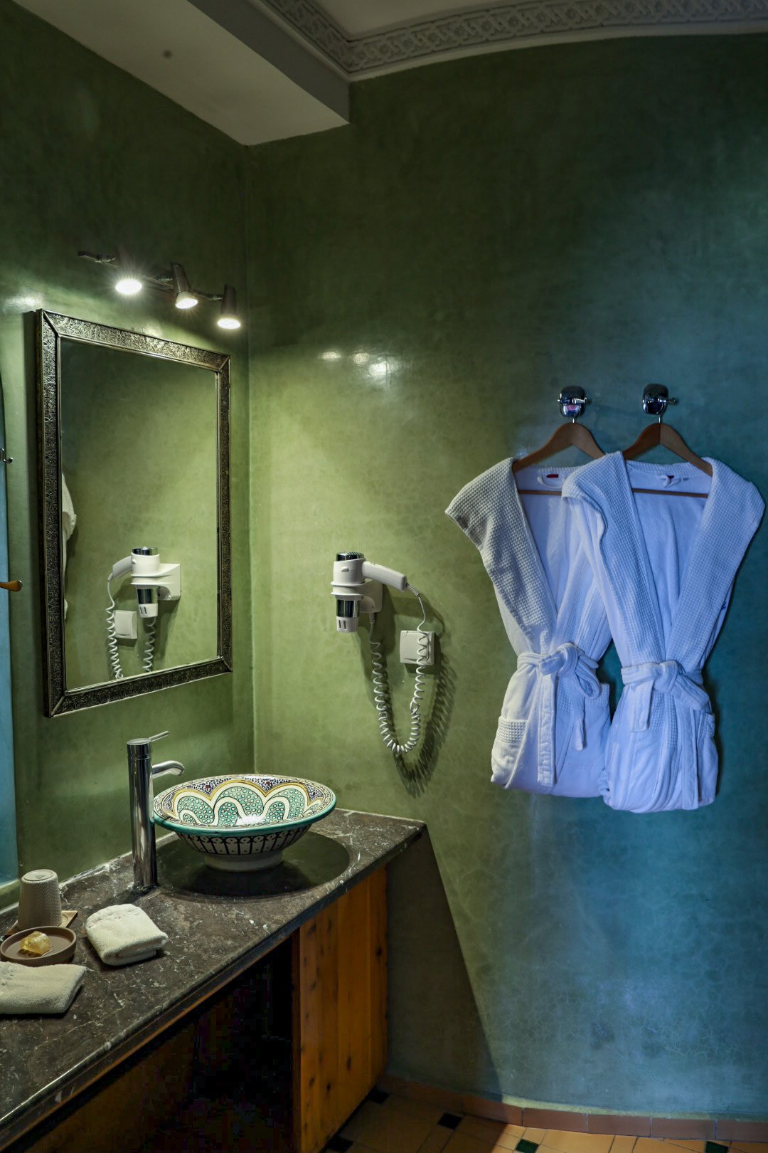The bathroom of with dressing gowns in Perle d'eau a luxury place to stay in Essaouira, Morocco