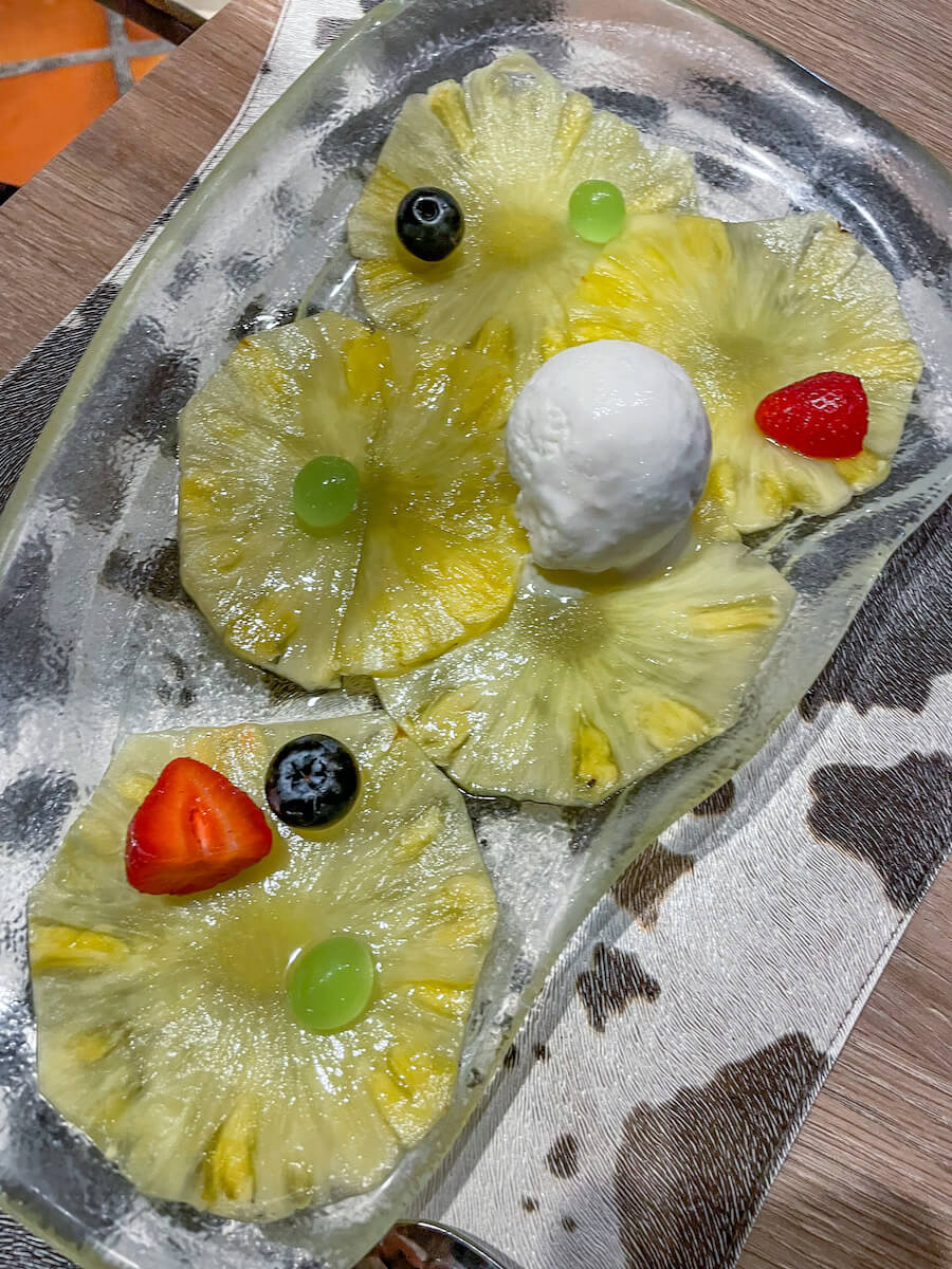 Pineapple with coconut ice cream served at El Gaucho Restaurant in Javea (Xabia)