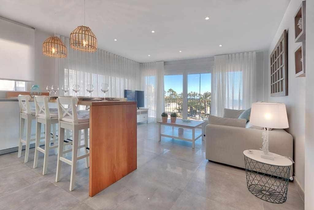 A crisply, sophisticated apartment overlooking the Arenal Beach in Javea Spain.