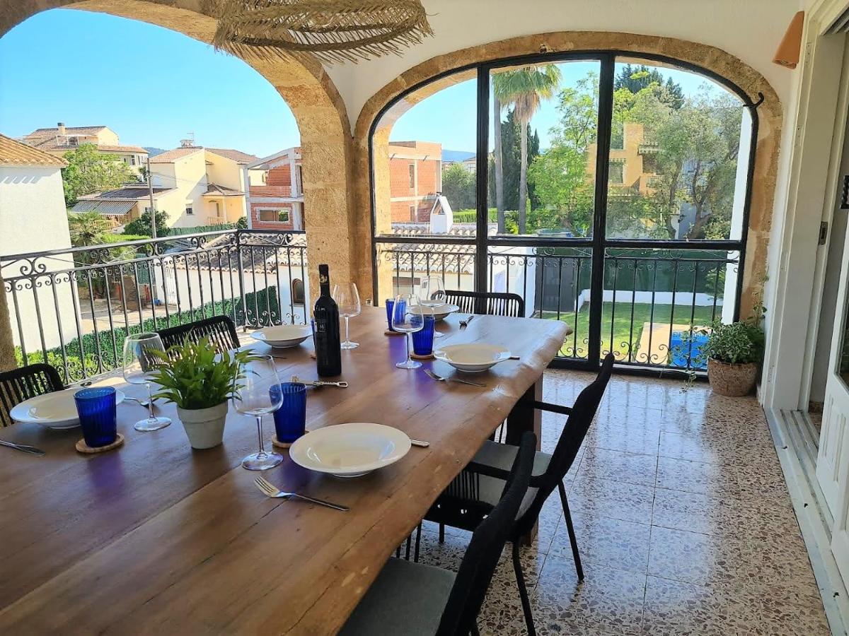 A table prepared for a meal on a holiday home terrace in Javea, Spain