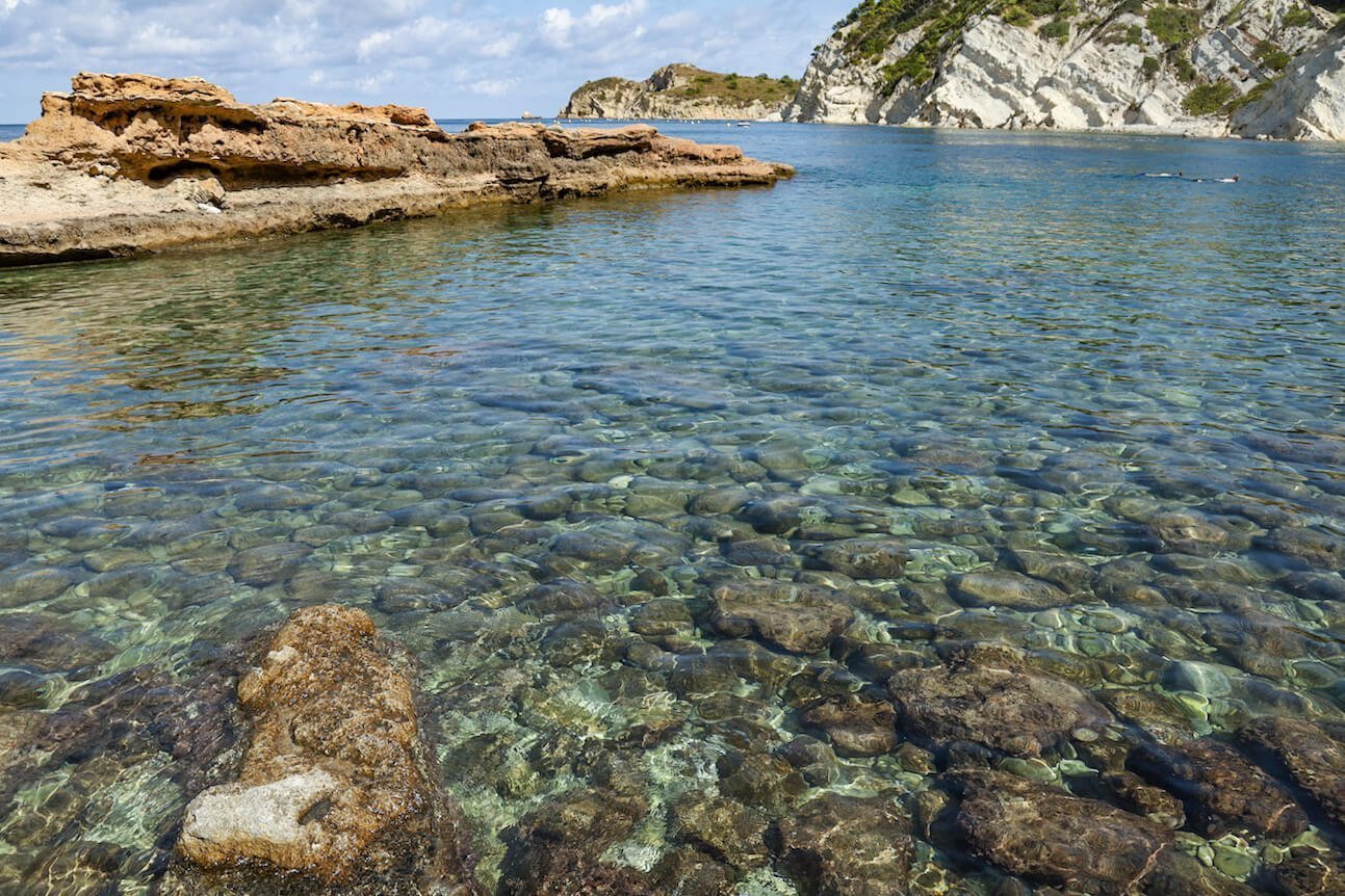 The beautiful bay of Caleta de Dins, with family snorkelling in the distance.