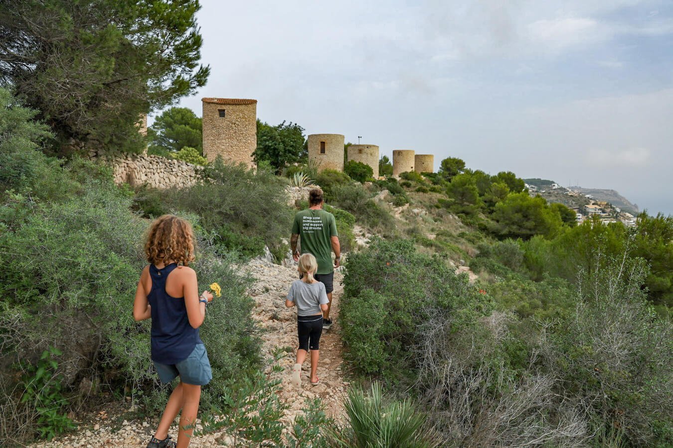 A hiking family explore the Molinos on the PR CV-355 walking trail in Javea / Xabia.
