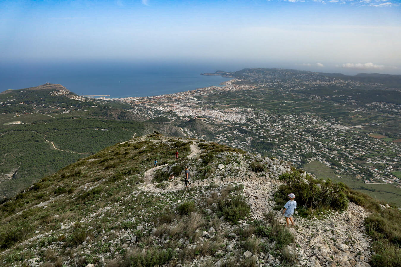 A family hike down after finishing their summit of Montgo in Javea, Spain - one of the most challenging treks in the region.
