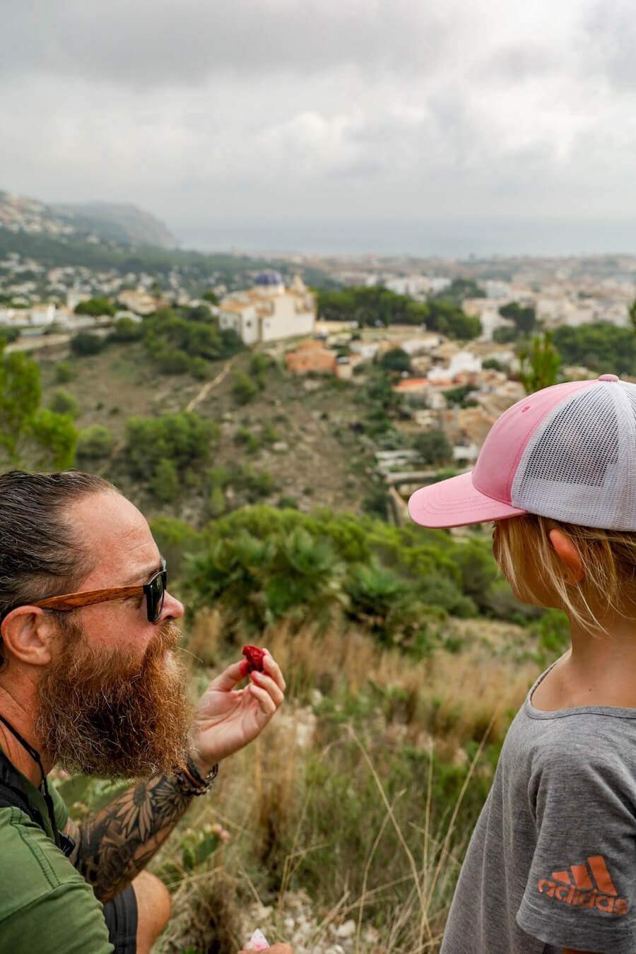 A father explains the prickly pear fruit to his daughter in Spain