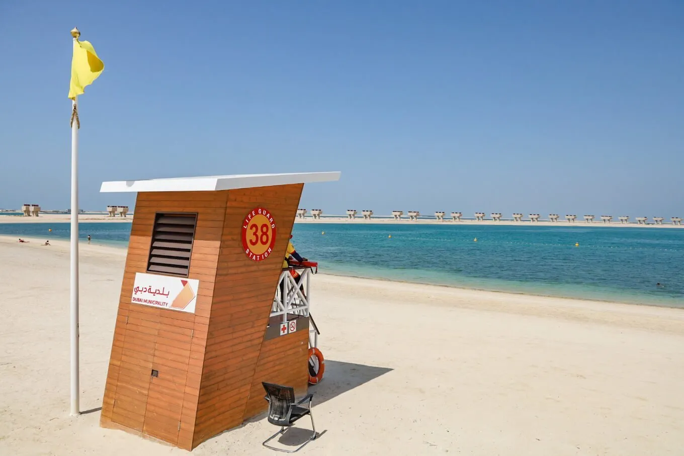 lifeguard tower on Jebel Ali Beach with the Jebel Ali Palm visible from the beach