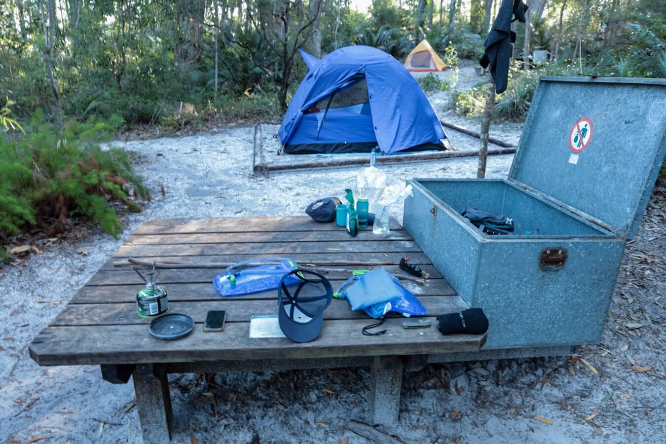 Tents and dingo storage boxes, with hikers equipment at the walkers campsites on K'gari Fraser Island.