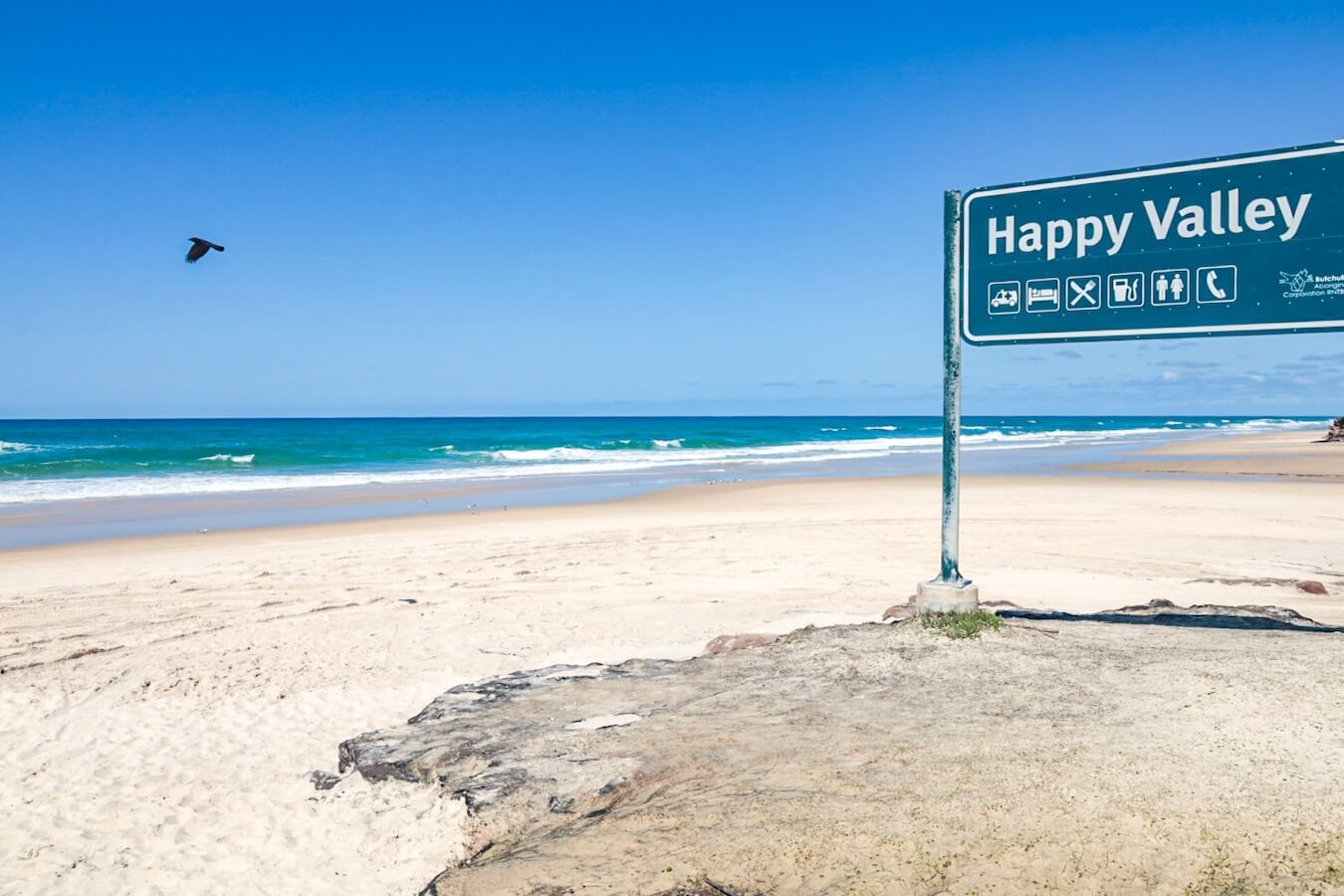 The beach and signpost at Happy Valley on Fraser Island.