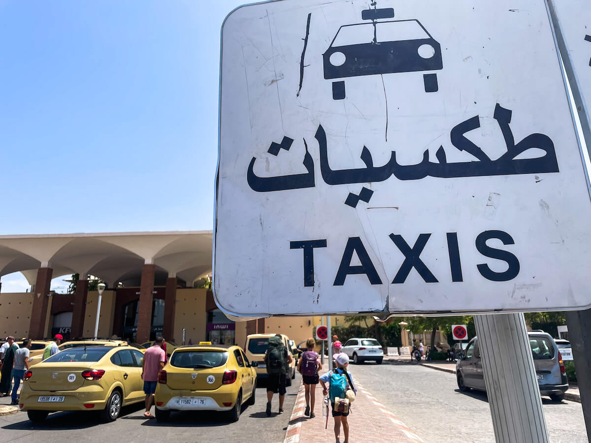 The taxi sign and stand at the busy train station in Marrakech, Morocco.