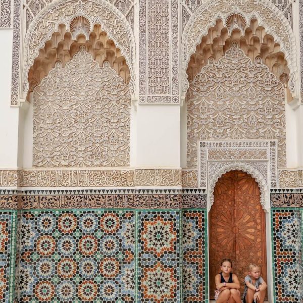 A Moroccan scene of tiled walls and arches on a typical Morocco travel itinerary