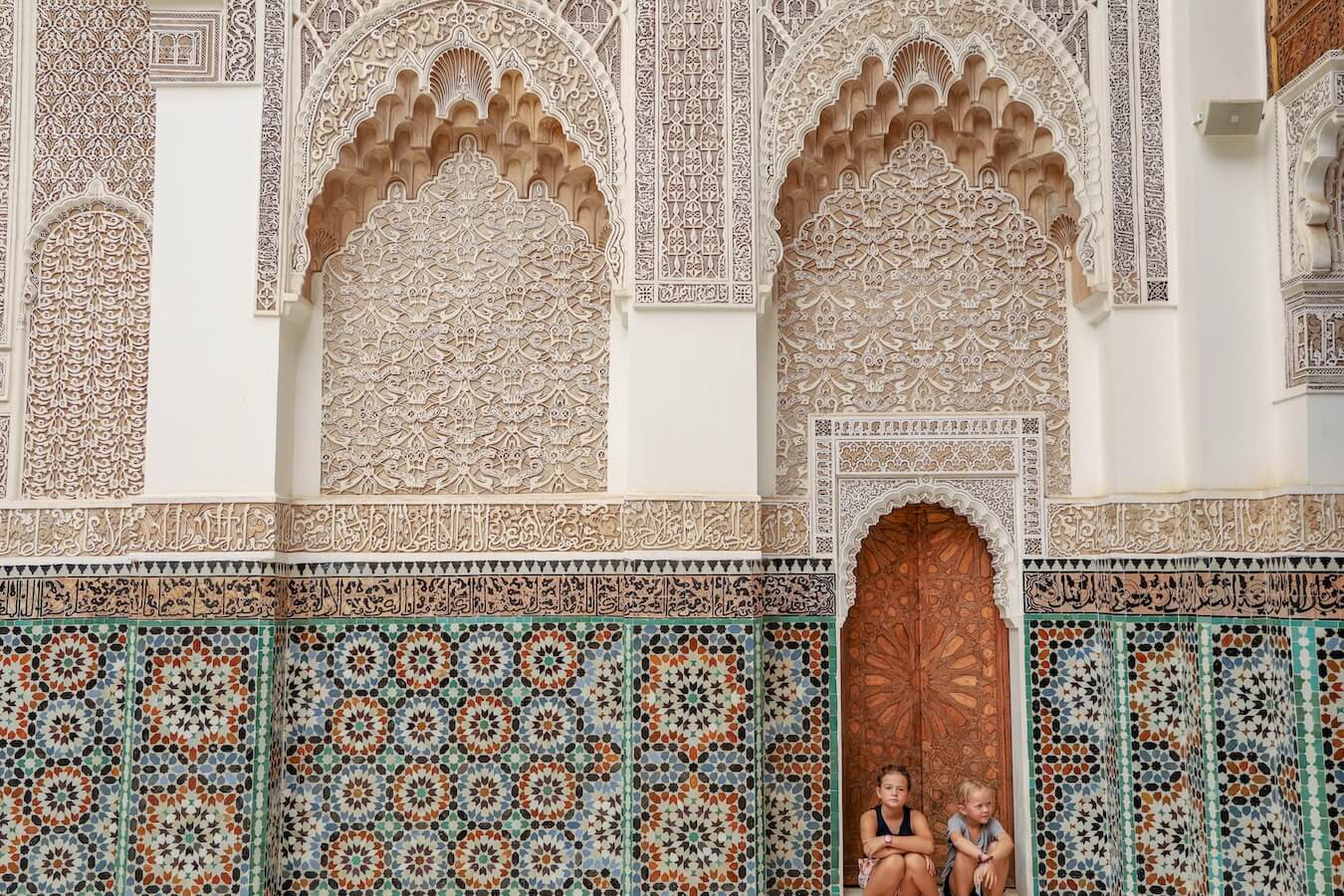 A Moroccan scene of tiled walls and arches on a typical Morocco travel itinerary