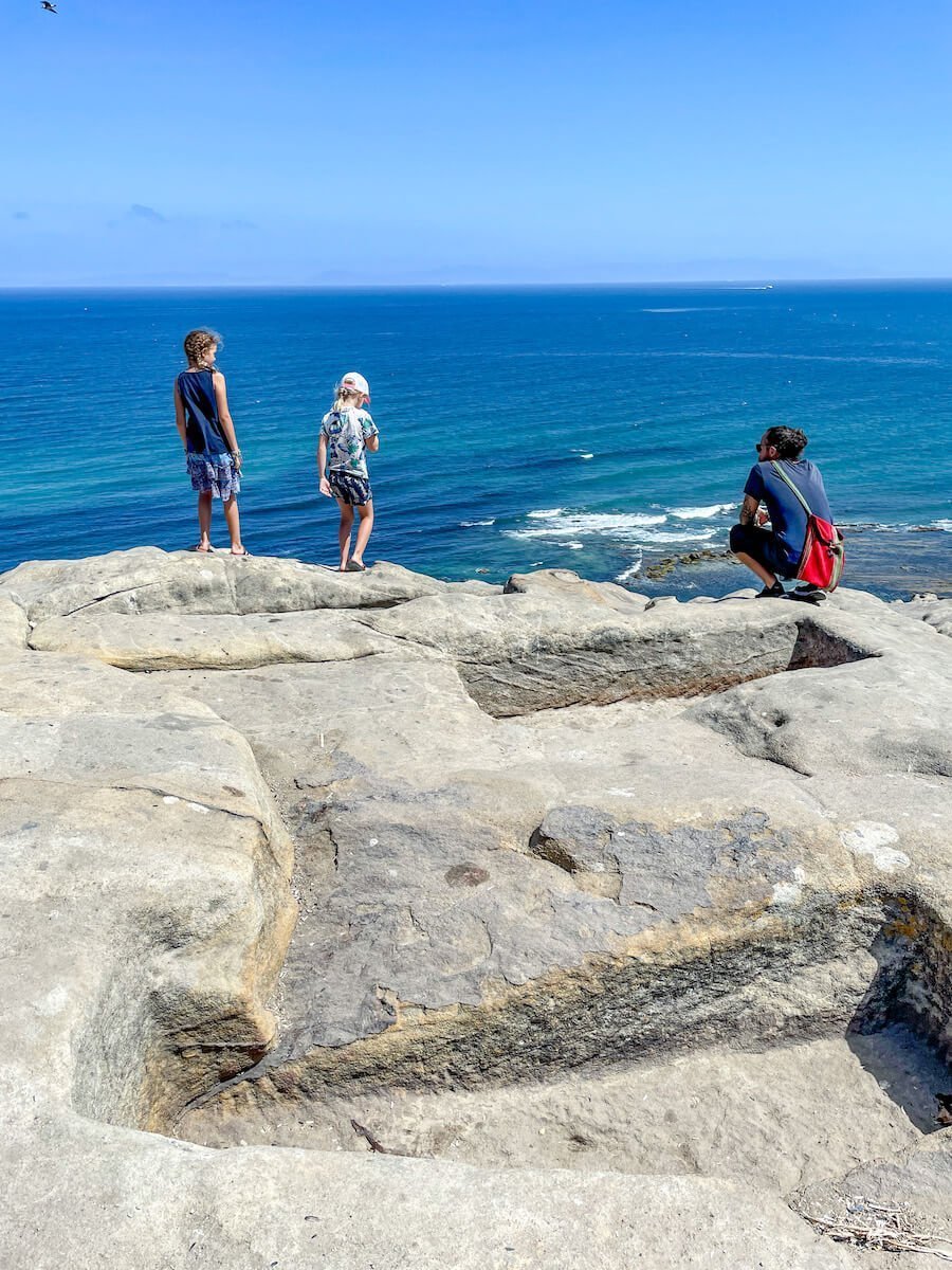 A family overlook the Strait of Gibraltar towards Spain from Tangier