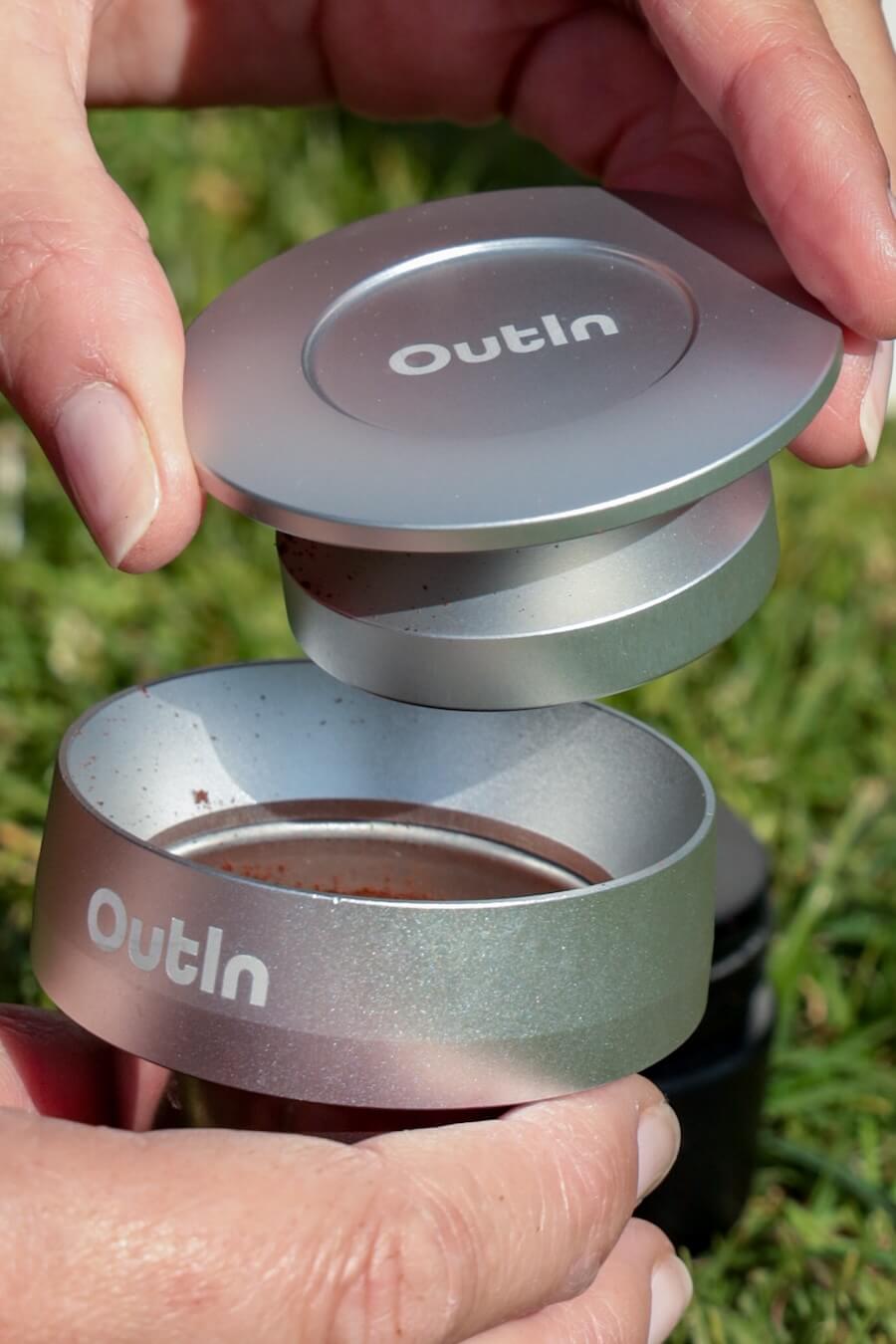 Coffee grounds are tamped with the OutIn tamper.