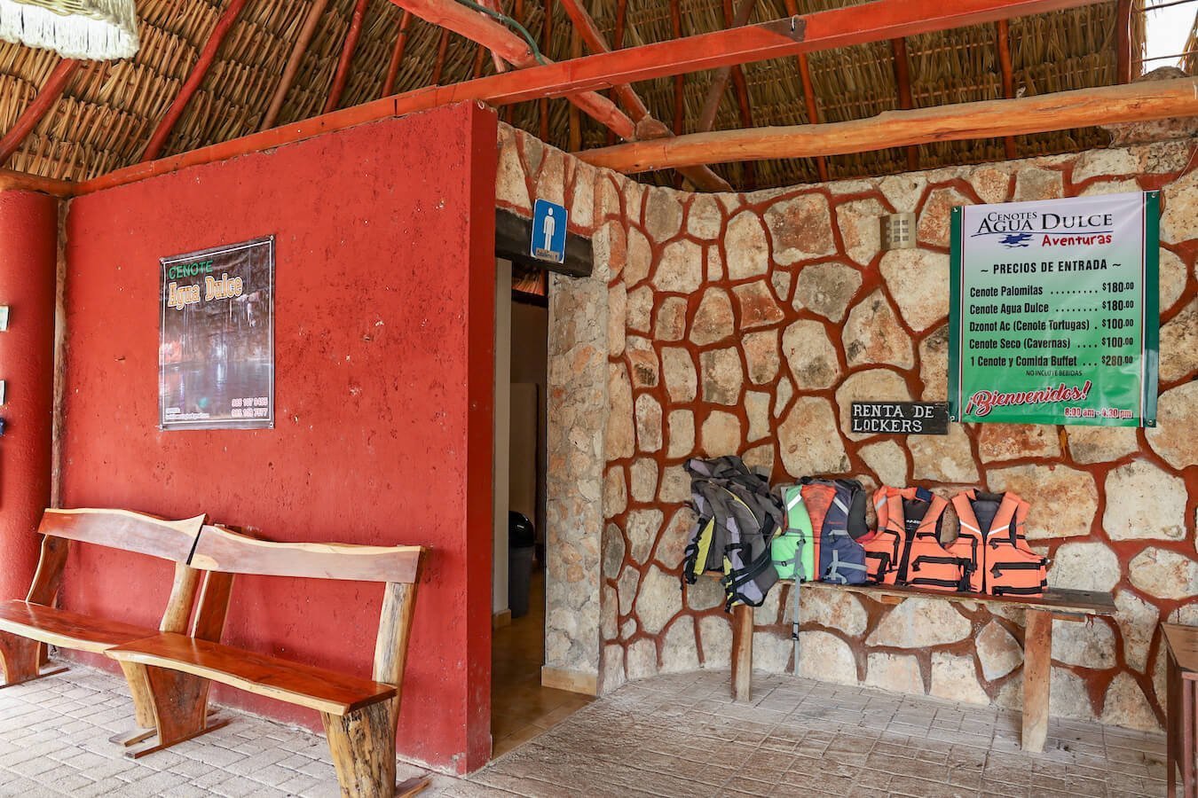 The entrance with prices to Cenote Agua Dulce and Palomitas near Valladolid - also advertising lockers for rental and life jacket.