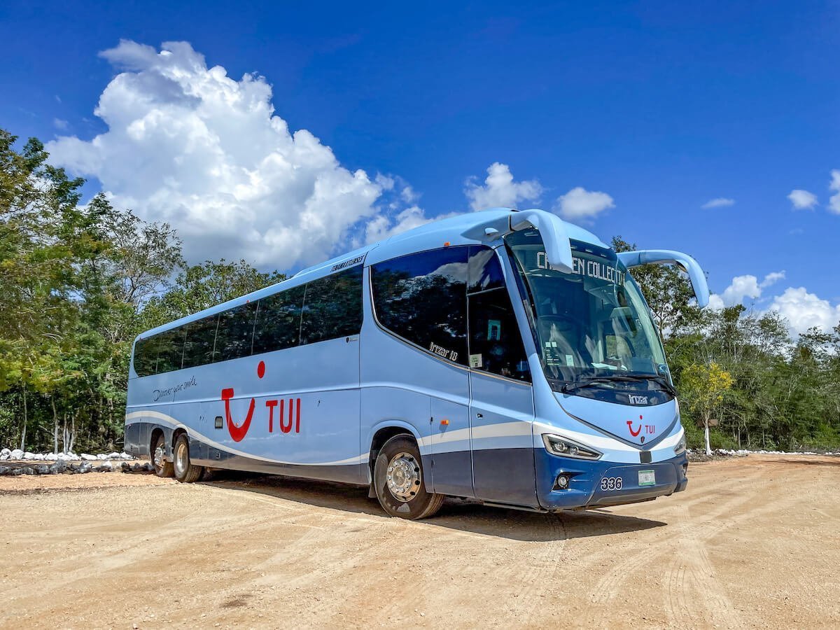 The Tui Tourist bus parked outside Agua Dulce Cenote near Valladolid
