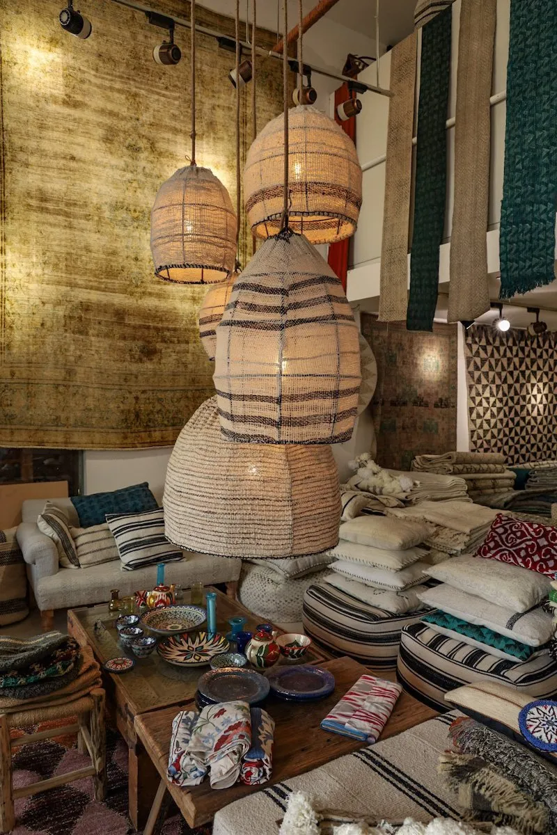 Hanging light fittings and carpets inside the Chuk Palu at the Dubai Creek
