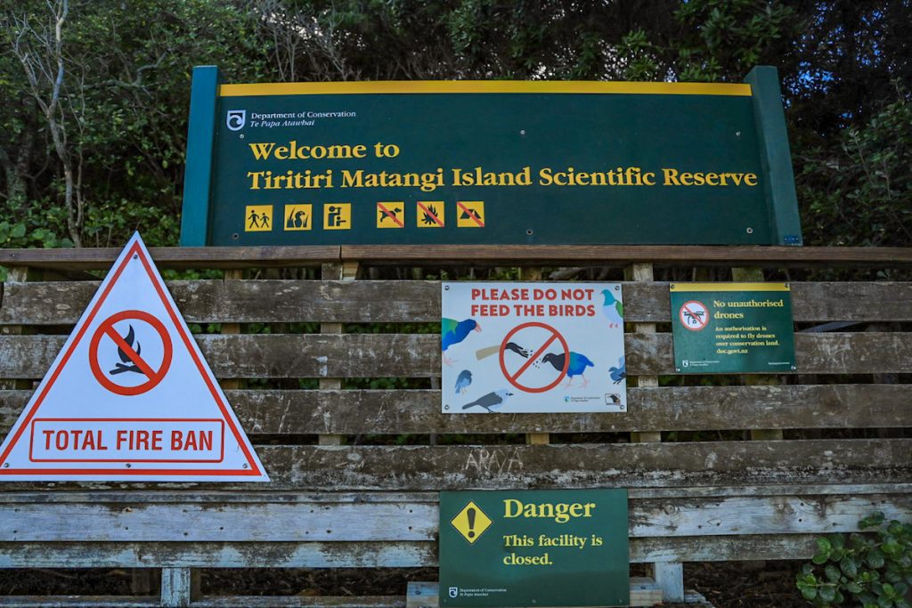 Welcome signs on Tiritiri Matangi - including signs prohibiting the feeding of the native birds.