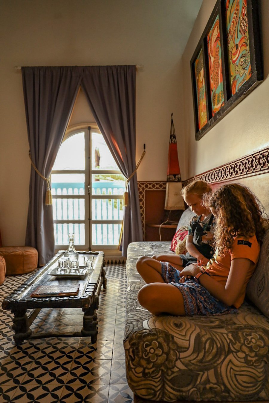 Children read books in the Pere Jago Suite in Ryad Watier