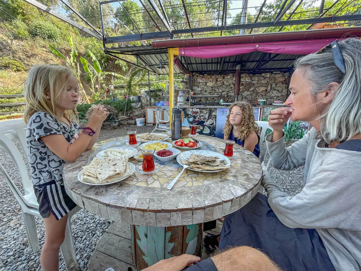 Family stop to eat Gozleme for lunch a traditional road side food in Turkey and great when on a road trip.