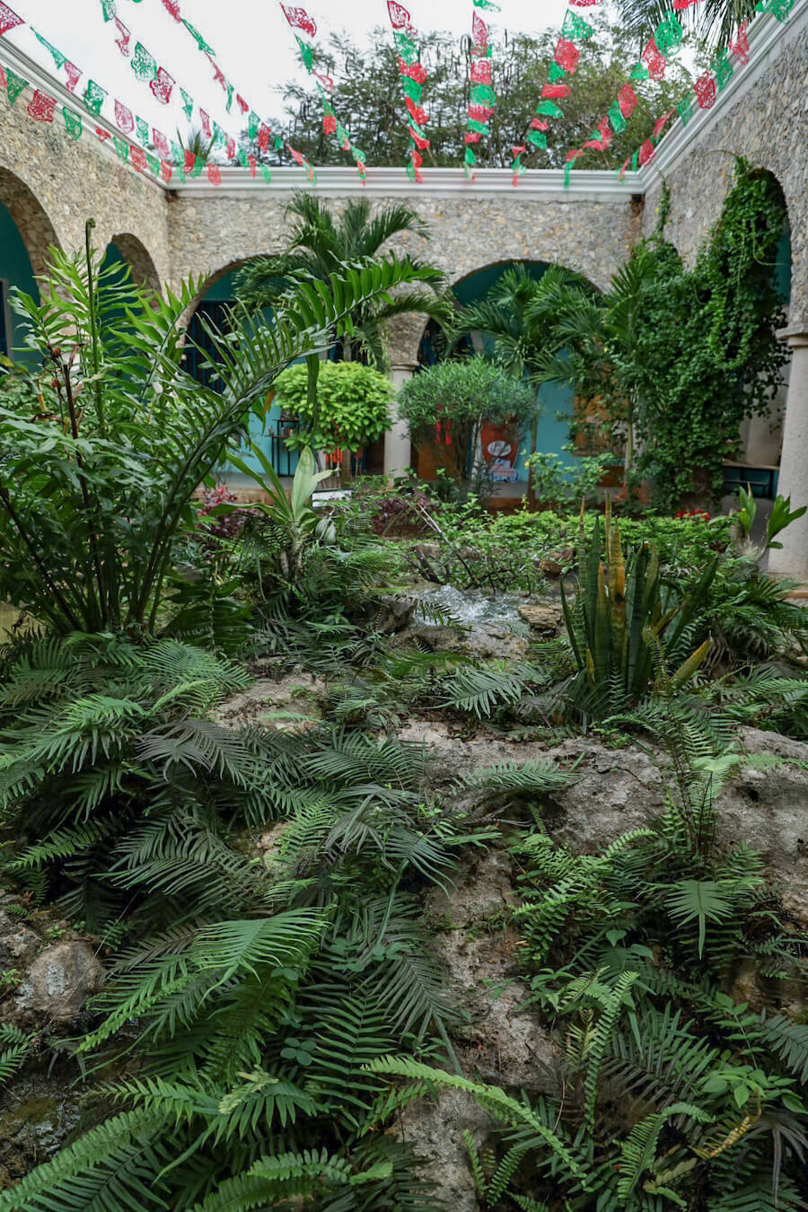 The green recently renovated entrance at Hacienda Selva Maya, near Valladolid
