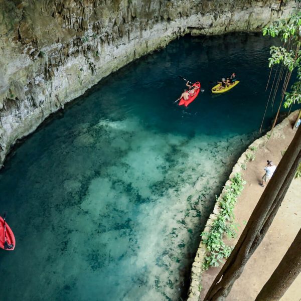 Looking down into the clear waters of Sac Aua Cenote - one of the best cenotes in Valladolid and the Yucatan Peninsula, Mexico.