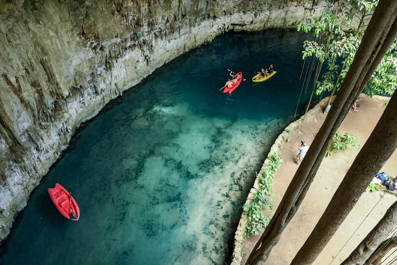 Looking down into the clear waters of Sac Aua Cenote - one of the best cenotes in Valladolid and the Yucatan Peninsula, Mexico.
