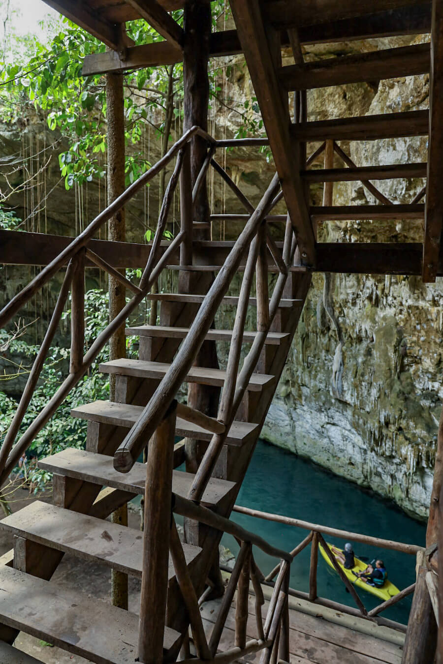 The wooden stair case leading down into the small island in Sac Aua Cenote near Valladolid.