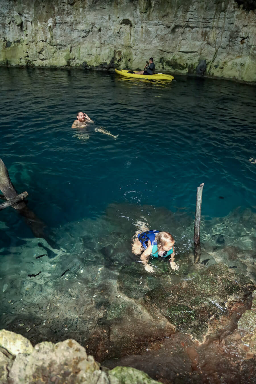 A family swim in Sac Aua cenote one of the best cenotes in Valladolid.