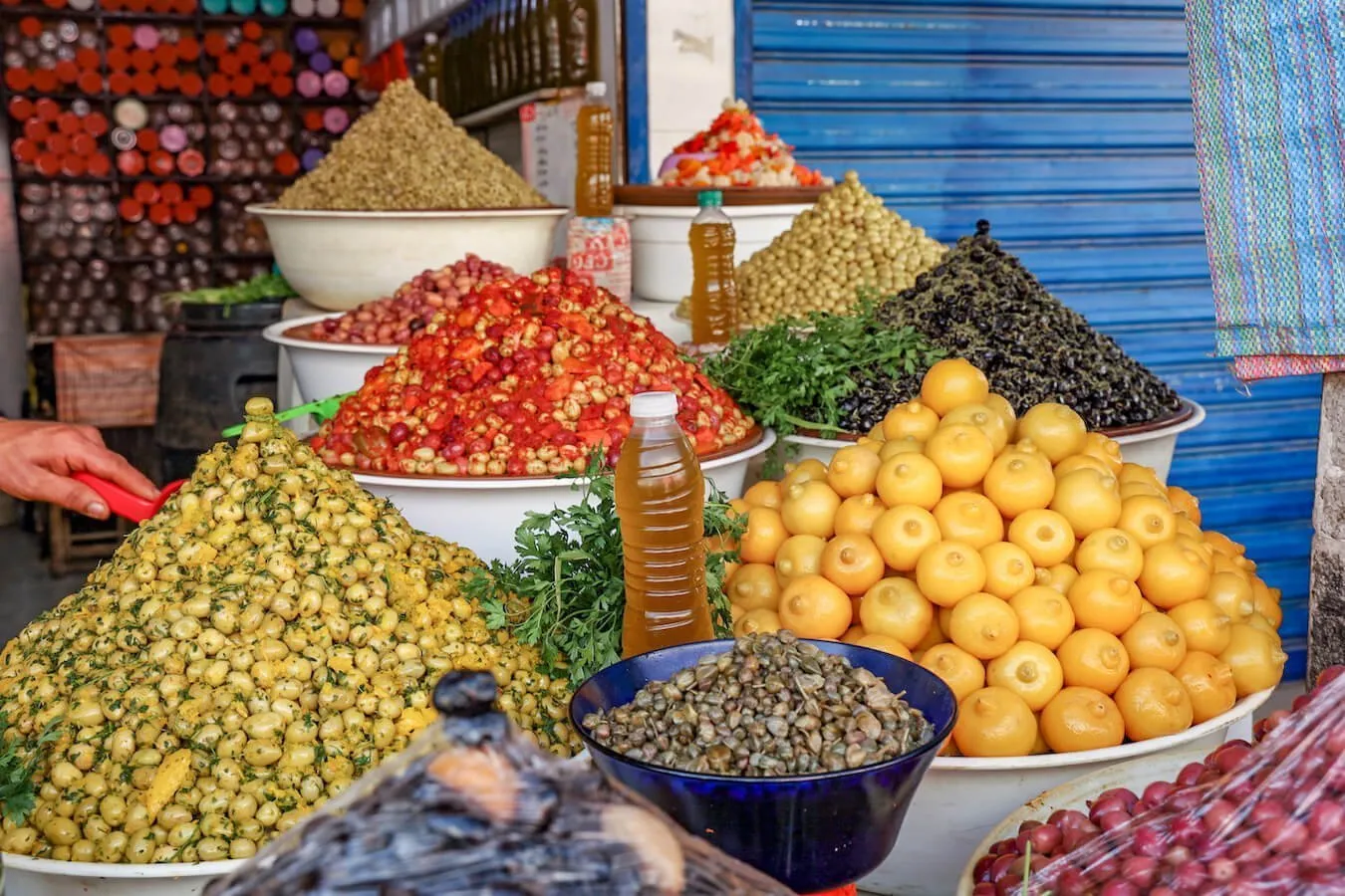 Olives and pickled lemons on display in the Central Mercado in Tangier - a great place to visit on a 1 day itinerary of the city.