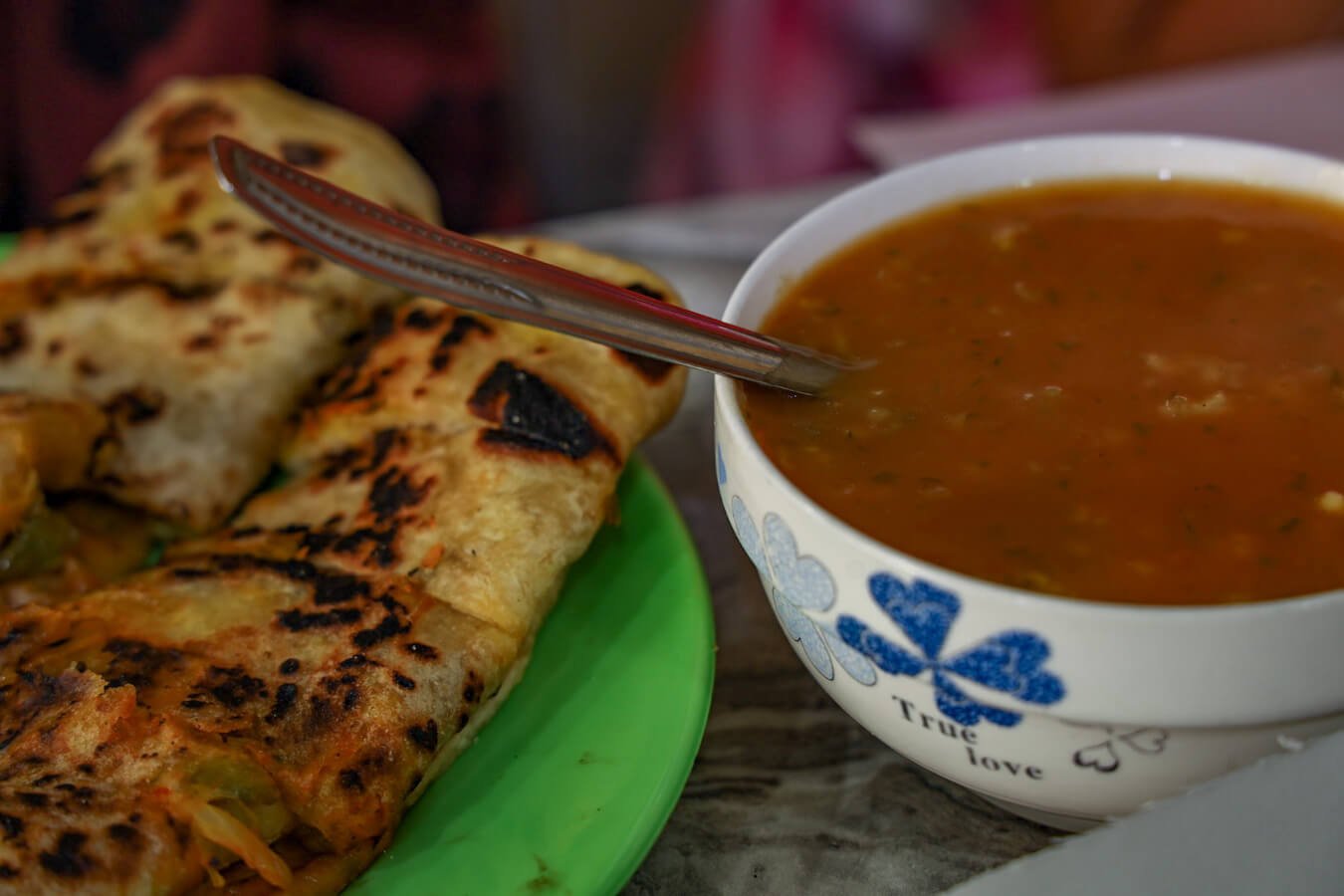 Harira soup and m'semen in Essaouira Medina at a street food stall