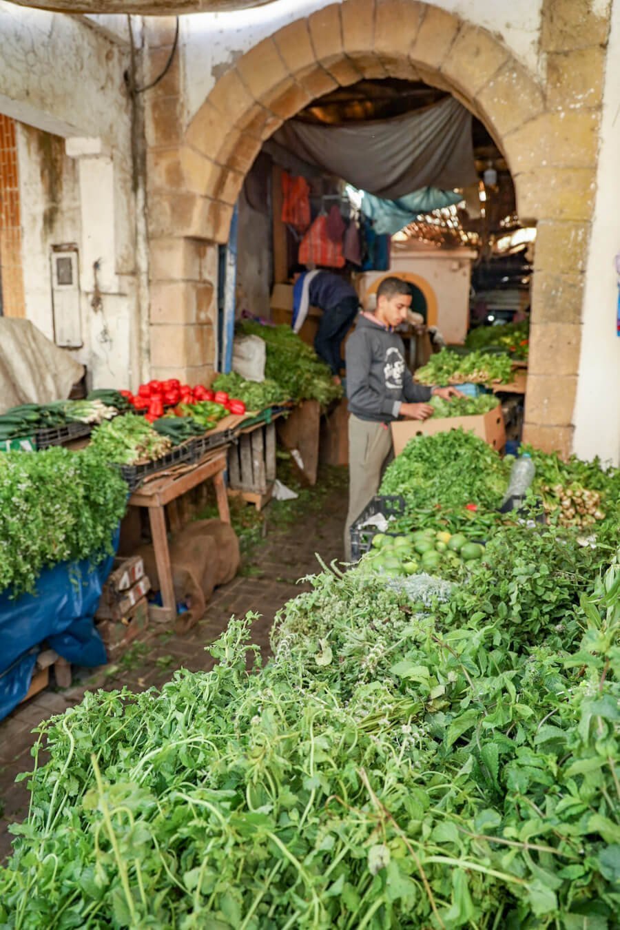 Tables of food line the market stalls in the Essaouira medina