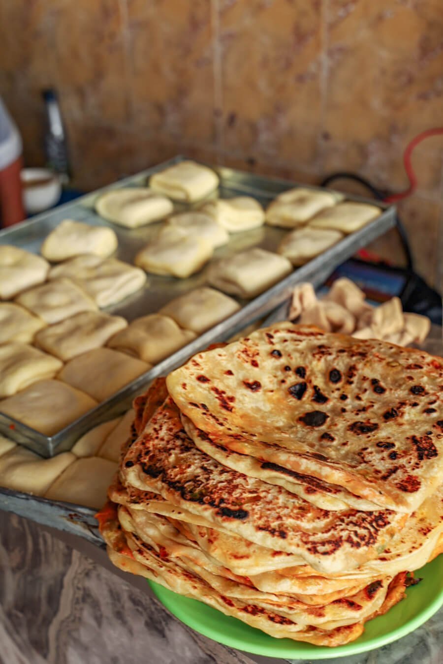 M'semen both cooked and uncooked in street food kitchen in Essaouira medina