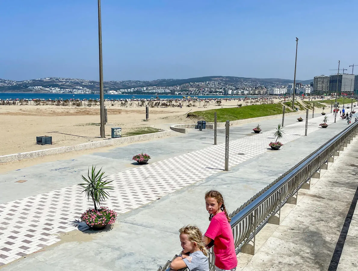 Two kids stand by the corniche and main municipality beach in Tangier while exploring top things to do in Tangier