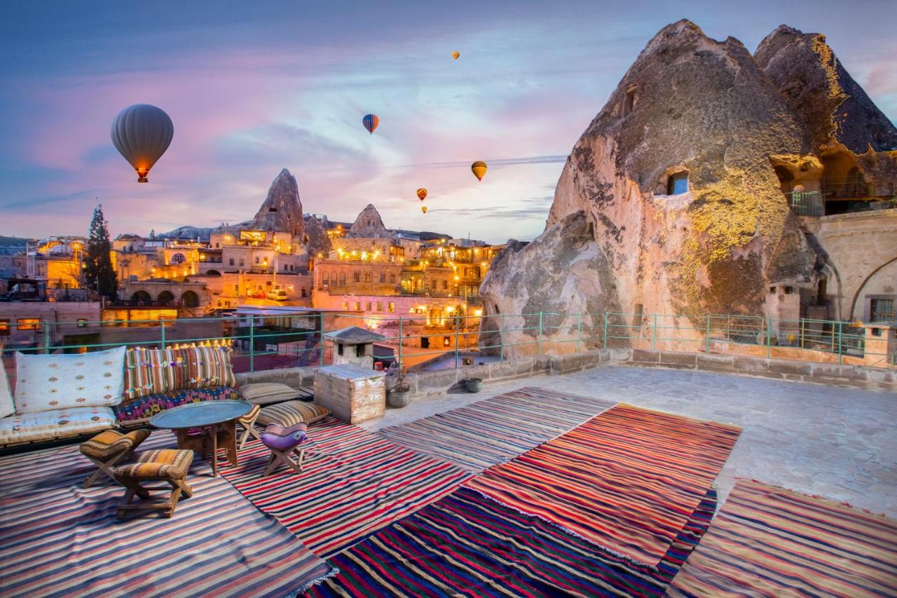 Sunrise from the Terra Cave Hotel in Cappadocia with views of hot air balloons and fairy chimneys