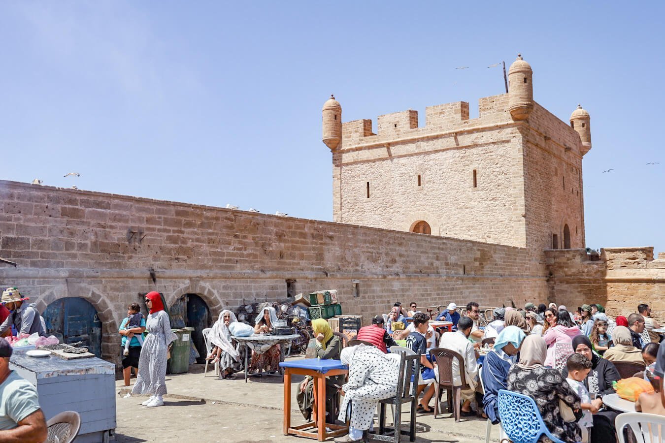 Families gather at the ports at the Skala fortress for a meal of fresh grilled fish.
