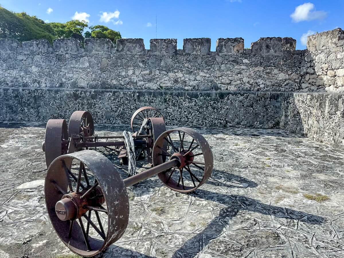 Inside the Fort San Felipe in Bacalar, showing the fort walls and canon.