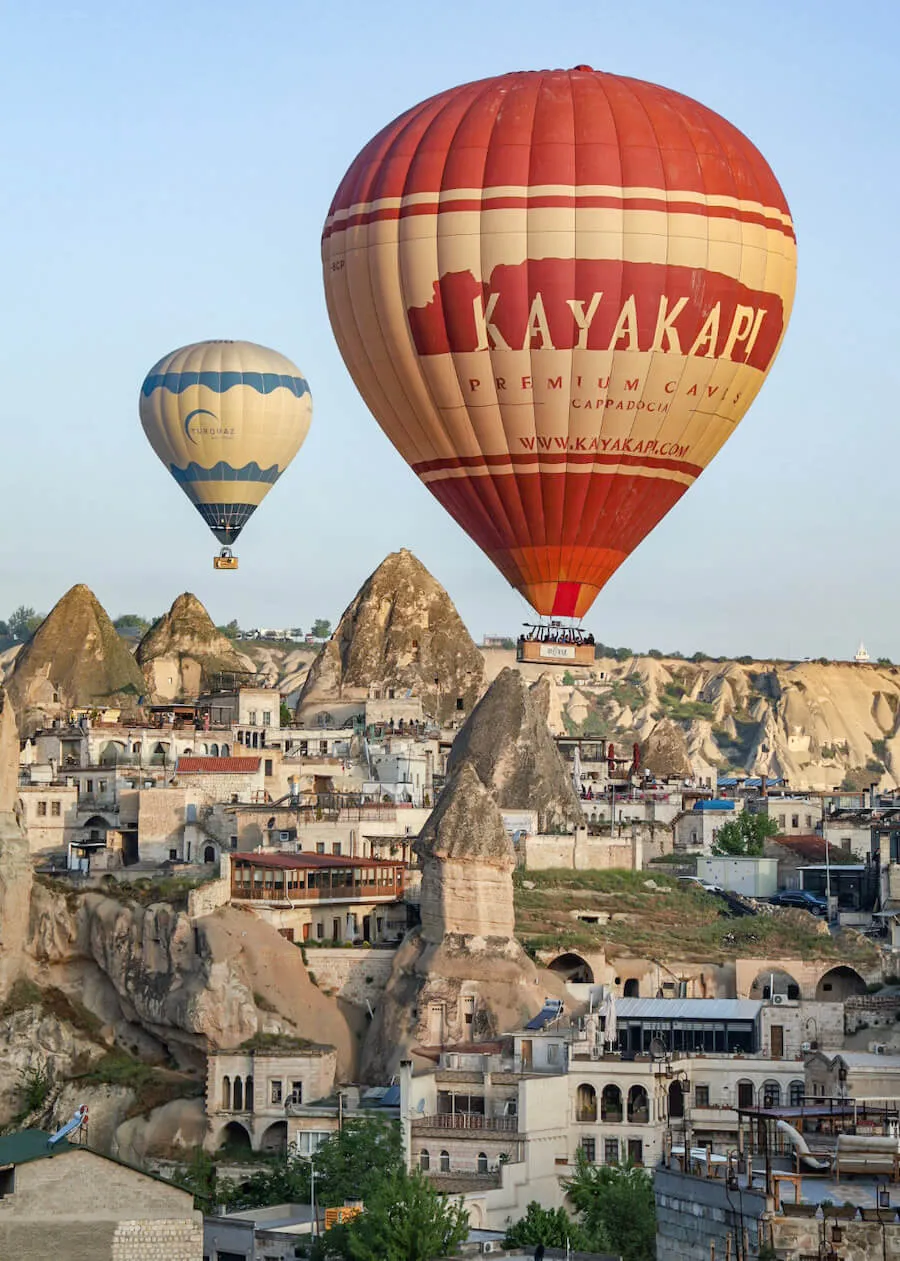 Hot air balloons float over Goreme in Cappadocia.