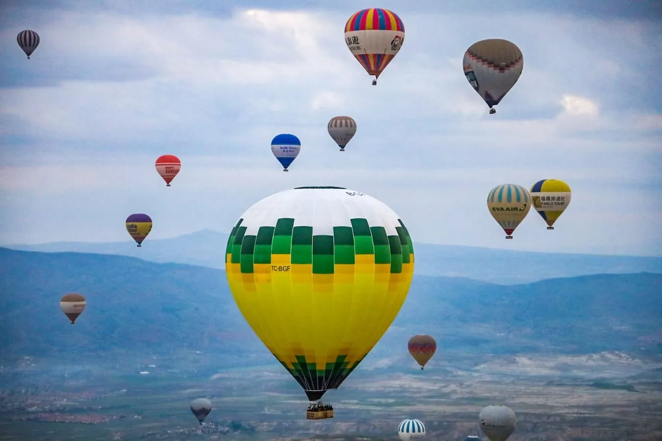 View of hot air balloons taken from another hot air balloon.