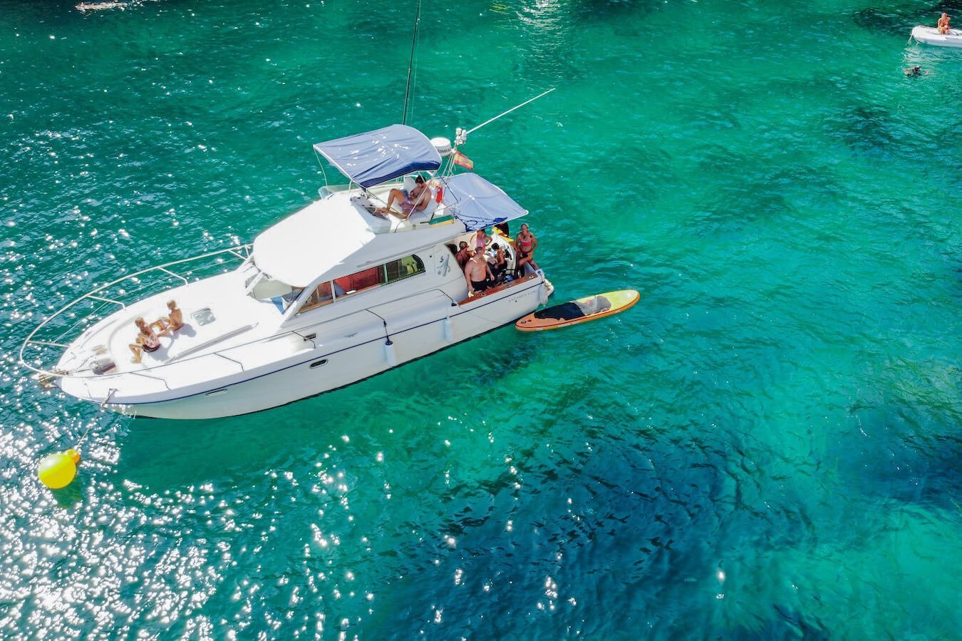 Holidaymakers on a boat tour in the Mediterranean sea in Javea Spain - one of the best things to do in Javea when on holiday