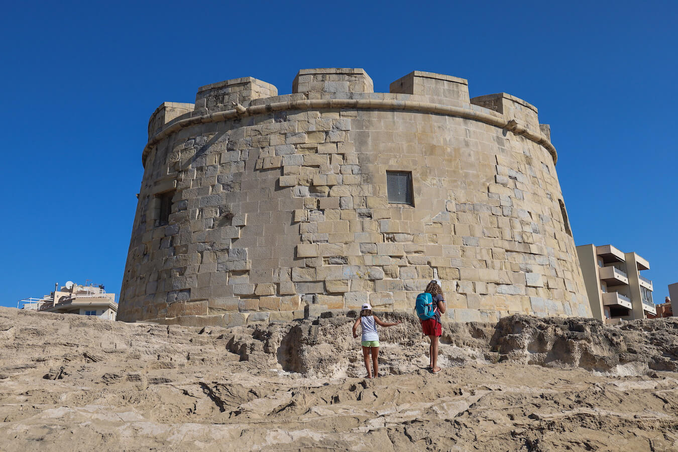 Kids walk infront of el Castillo in Moraira