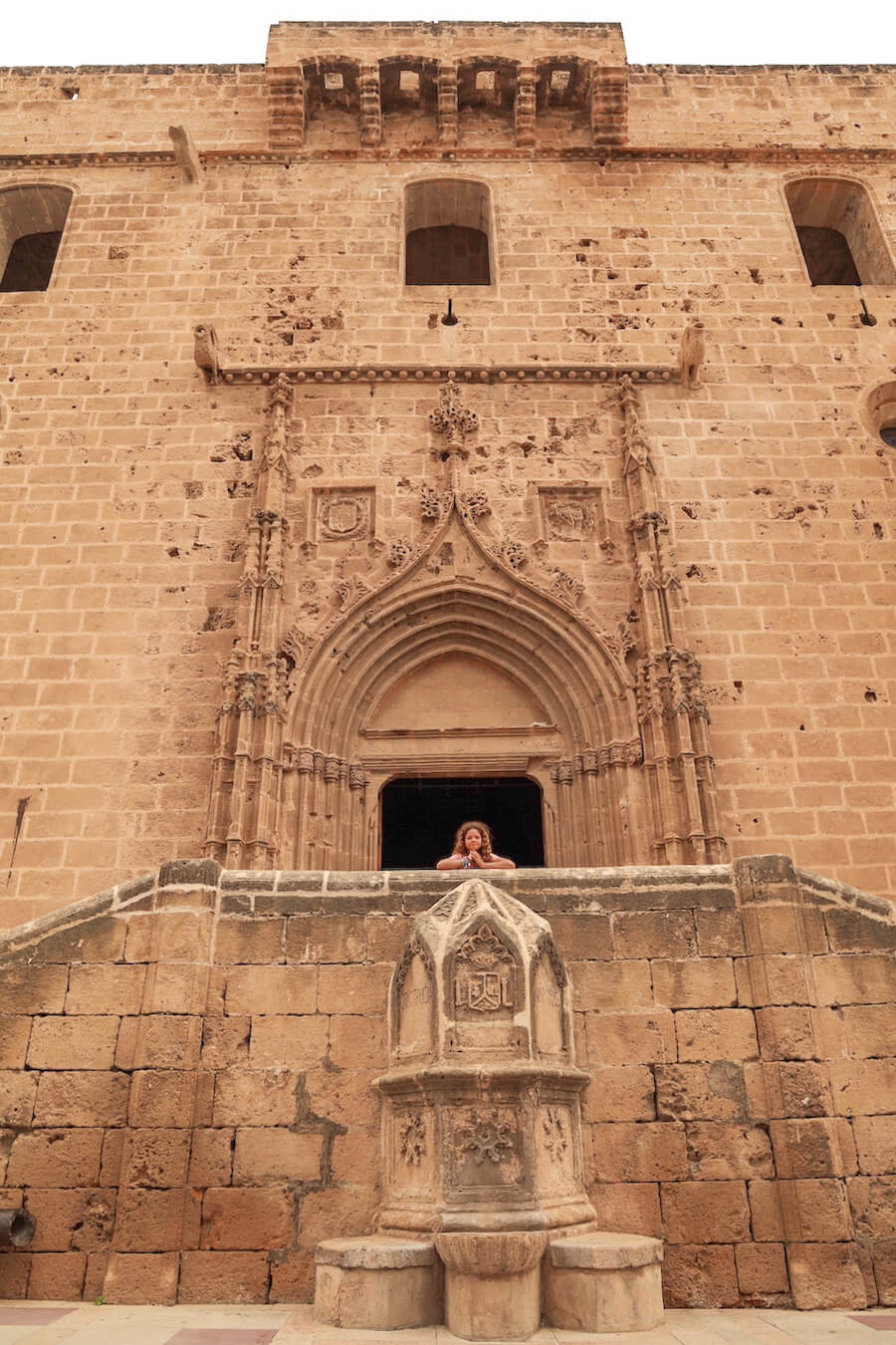 The tosca sandstone facade and entrance of the Bartholomew Church is the Historic Centre of Old Town of Javea / Xabia.