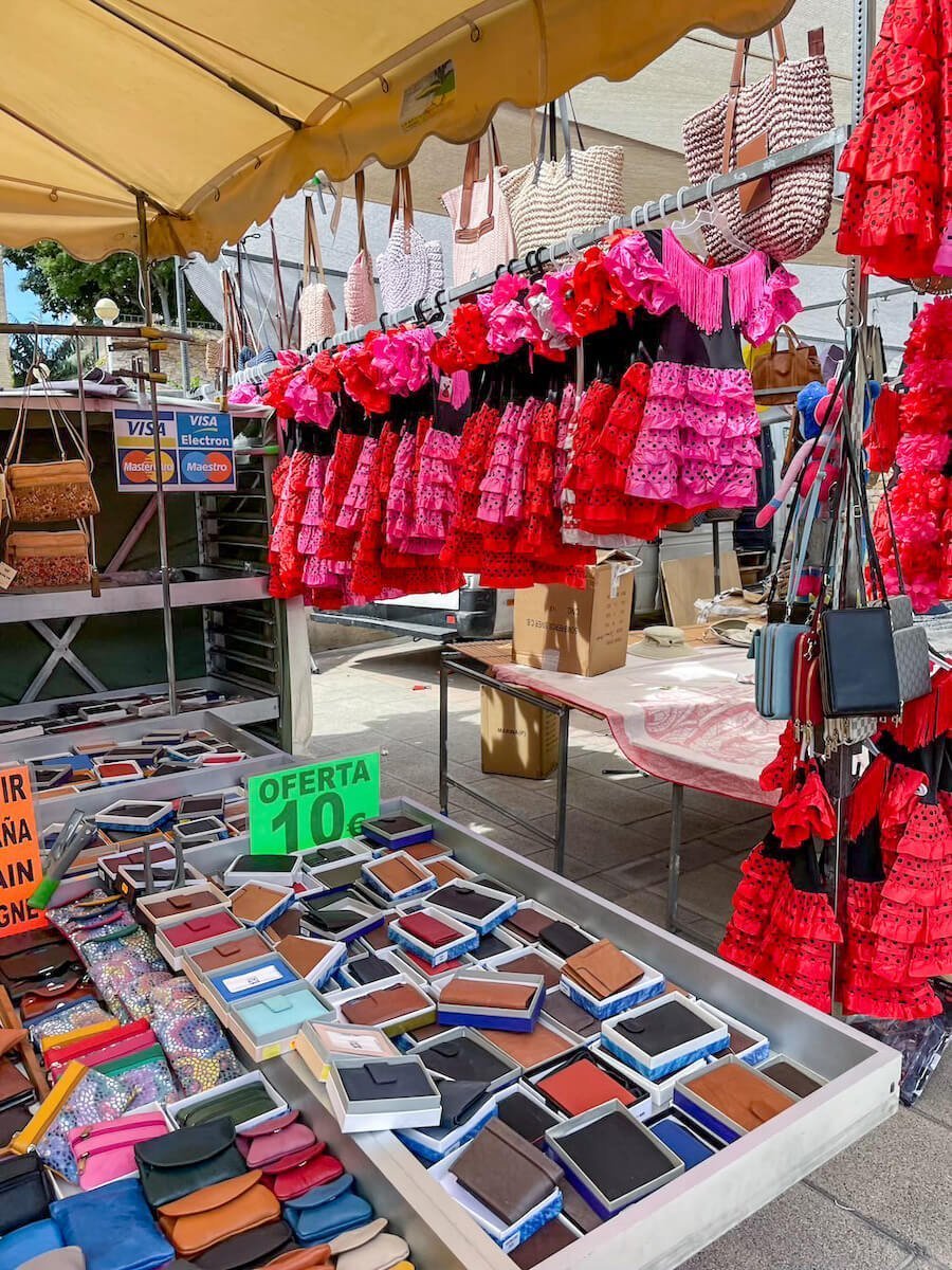 A market in Spain selling flamenco dresses and wallets