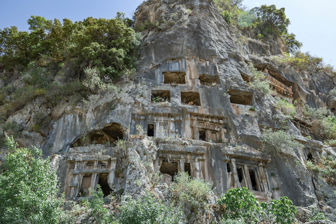 The rock tombs carved into a cliffside at the Myra ruins near Demre and Kas.