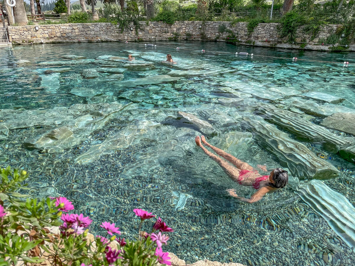 Family swim in the thermal healing waters of the Antique Cleopatra Pools near the Travertine Terraces of Pammukale and Hierapolis. This is a great thing to do when visiting the area.