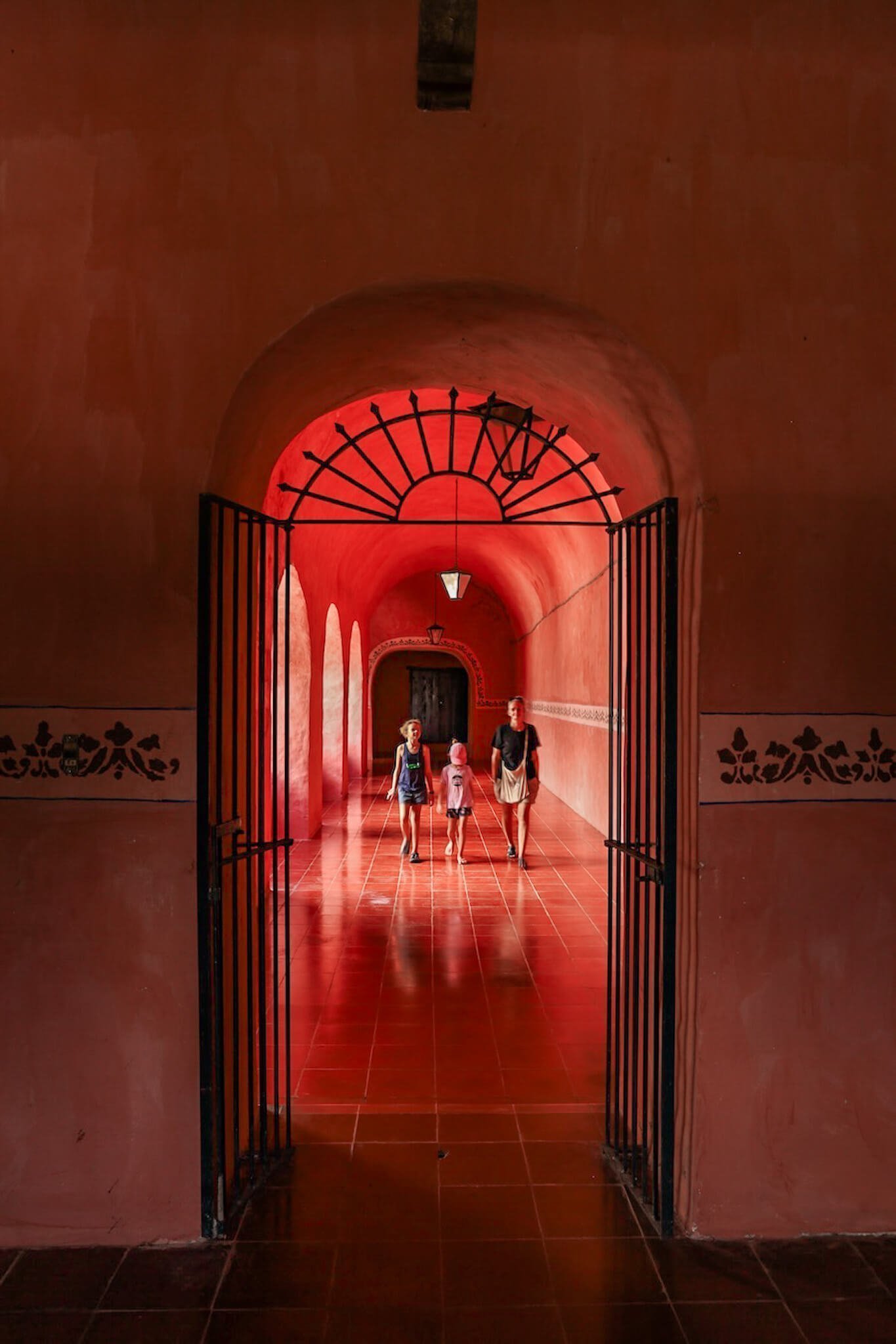 Inside the rose coloured walls and arches of the Convento de San Bernardino de Siena - a must see on a list of things to do in Valladolid