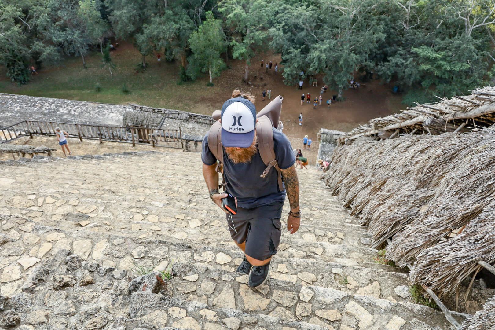 A man walks up the steep stairs of the Ek'Balam ruins near Valladolid - a great thing to do when visiting Valladolid
