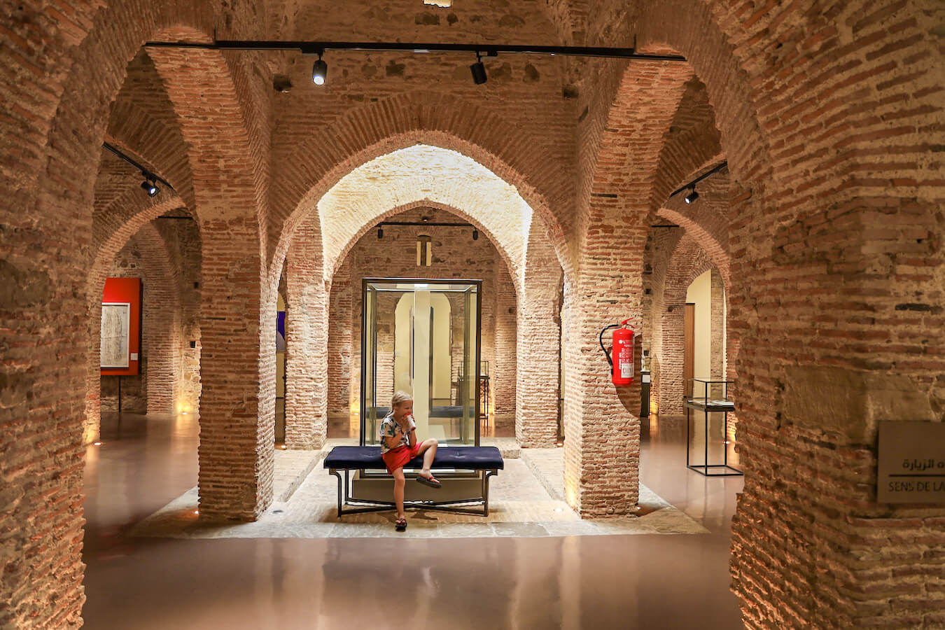 A child sits in the Contemporary Art Museum in Tangier - one of the top things to do in Tangier