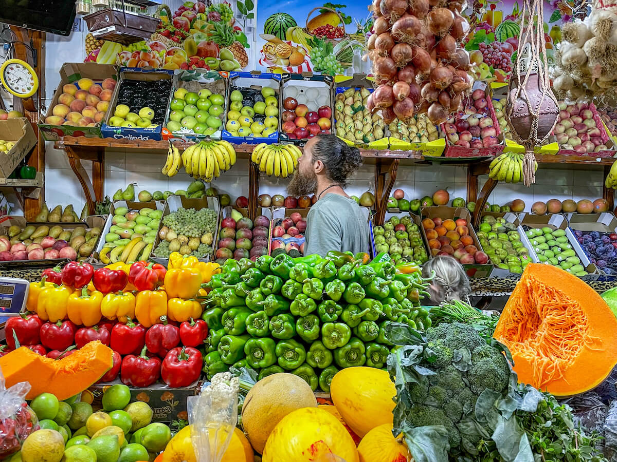 Shopping at the fresh fruit and vegetable market in the medina in Tangier Morocco - a great place to visit on a 3 day itinerary
