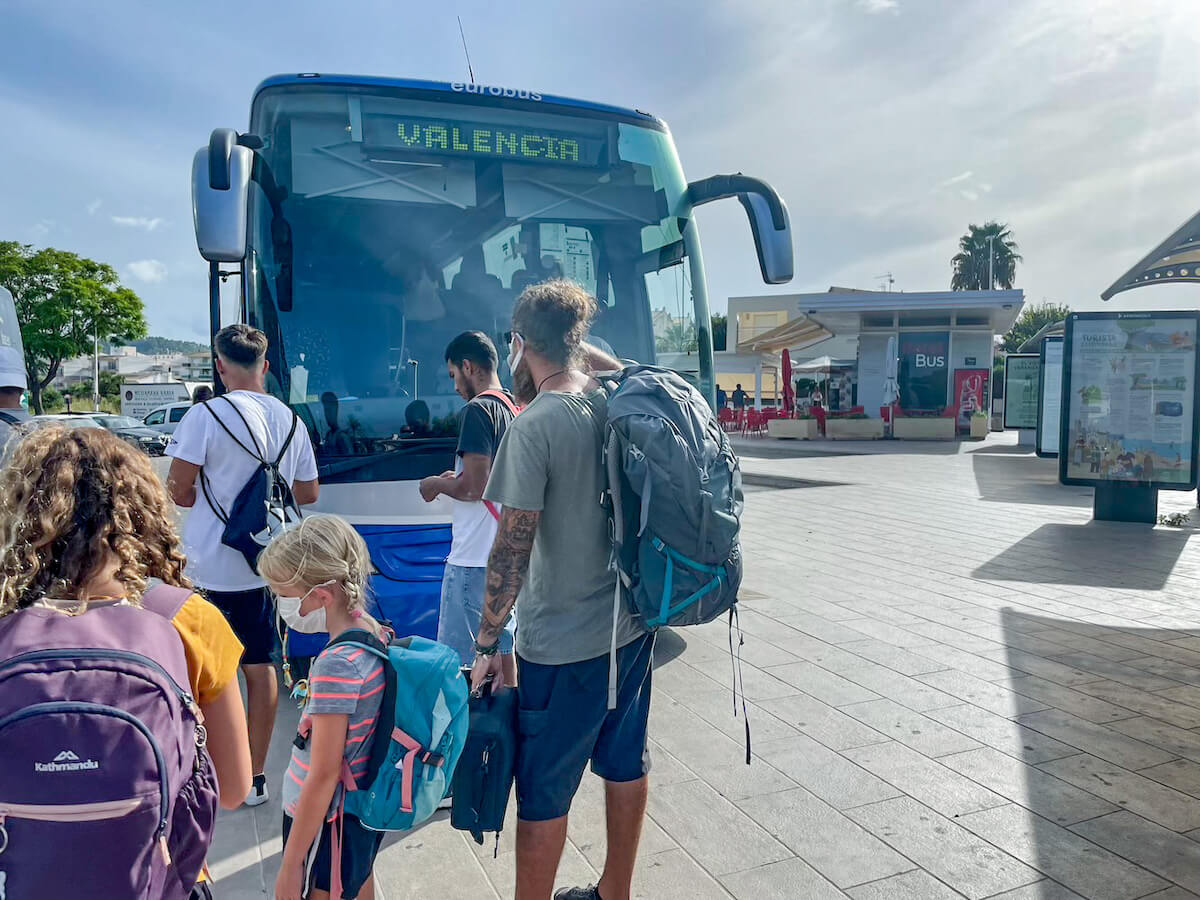 A family waiting to board the Alsa bus on their journey from Javea to Valencia