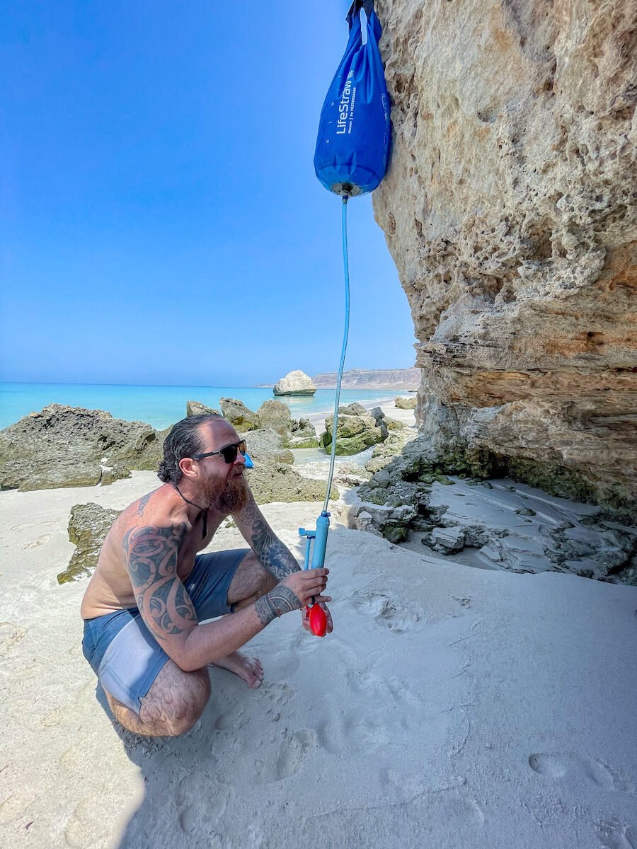 Camping on Socotra Island Yemen with a LifeStraw to reduce plastic waste.